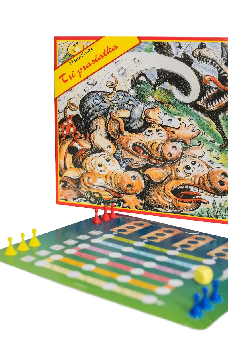 Rodinná hra Tri prasiatka v stojacej polohe s ilustráciou vlka a otvorenou hracou doskou s domčekmi prasiatok